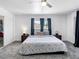 Spacious main bedroom features neutral colors, ceiling fan, and comfortable carpet at 1700 E Oakey Blvd, Las Vegas, NV 89104