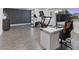 Bright office space with modern desk, workout equipment, and gray vinyl flooring at 1700 E Oakey Blvd, Las Vegas, NV 89104