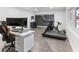 Bright office space with modern desk, workout equipment, and gray vinyl flooring at 1700 E Oakey Blvd, Las Vegas, NV 89104
