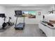 Bright office space with workout equipment, gray vinyl flooring, and a view of the outdoors at 1700 E Oakey Blvd, Las Vegas, NV 89104