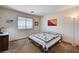 Inviting bedroom featuring carpet flooring, natural light from a window, and minimalist decor for a relaxing retreat at 1902 Panther Pl, North Las Vegas, NV 89031