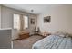 Bright bedroom includes a twin bed, natural light from the window, and a cozy atmosphere at 1902 Panther Pl, North Las Vegas, NV 89031