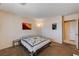 Clean bedroom showcases a comfortable quilt-covered bed, closet, and neutral decor for a welcoming atmosphere at 1902 Panther Pl, North Las Vegas, NV 89031