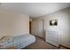 Simple bedroom design featuring carpet flooring, neutral walls, and a closet for practical and comfortable living at 1902 Panther Pl, North Las Vegas, NV 89031