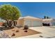Charming single-story home with a two-car garage, desert landscaping, and a welcoming entrance at 1902 Panther Pl, North Las Vegas, NV 89031