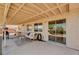 Covered patio featuring outdoor furniture, a grill, and sliding glass doors for indoor/outdoor living at 1902 Panther Pl, North Las Vegas, NV 89031