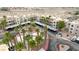 Aerial view of the community pool in a complex surrounded by desert landscape at 2040 Mesquite Ln # 203, Laughlin, NV 89029
