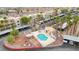 Aerial view of community pool and palm trees near condo parking areas at 2040 Mesquite Ln # 203, Laughlin, NV 89029