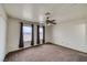 Cozy bedroom with carpet, ceiling fan, and a window with mountain views at 2040 Mesquite Ln # 203, Laughlin, NV 89029