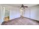 Bright bedroom boasts neutral carpet, ceiling fan, closet and access to the en-suite bathroom at 2040 Mesquite Ln # 203, Laughlin, NV 89029