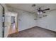 Bedroom with carpet, a ceiling fan, and an open doorway at 2040 Mesquite Ln # 203, Laughlin, NV 89029