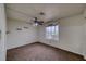 An empty bedroom with carpet, a ceiling fan and natural light from the window at 2040 Mesquite Ln # 203, Laughlin, NV 89029