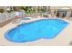 A ground level view of the community pool with blue water and stone trim at 2040 Mesquite Ln # 203, Laughlin, NV 89029
