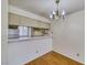 Dining area showcasing a pass-through view to the kitchen and chandelier at 2040 Mesquite Ln # 203, Laughlin, NV 89029