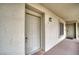 Condo entrance with a secure, sturdy door and outdoor lighting at 2040 Mesquite Ln # 203, Laughlin, NV 89029