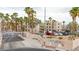 Portofino Condominiums gated entrance with lush landscaping and palm trees at 2040 Mesquite Ln # 203, Laughlin, NV 89029