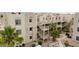 Condo building featuring a well-maintained exterior with desert landscaping and exterior stairs at 2040 Mesquite Ln # 203, Laughlin, NV 89029