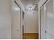 Hallway view featuring a closet, laundry area, and wood floors at 2040 Mesquite Ln # 203, Laughlin, NV 89029