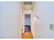 Hallway features wood-look flooring and leads to the bedroom, thermostat and wall switch are visable at 2040 Mesquite Ln # 203, Laughlin, NV 89029