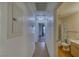 Hallway with wood-style floors leading to a bathroom and bedroom with natural light at 2040 Mesquite Ln # 203, Laughlin, NV 89029