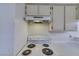The kitchen features a white range and above range hood at 2040 Mesquite Ln # 203, Laughlin, NV 89029