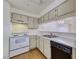 This kitchen features a dishwasher, stove, and stainless steel sink at 2040 Mesquite Ln # 203, Laughlin, NV 89029