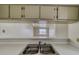 The kitchen features a stainless steel sink with a view to the living area at 2040 Mesquite Ln # 203, Laughlin, NV 89029
