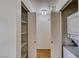 Practical laundry area with built-in shelving, washer, and dryer at 2040 Mesquite Ln # 203, Laughlin, NV 89029