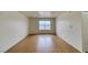 Spacious living area with wood floors and a window letting in natural light at 2040 Mesquite Ln # 203, Laughlin, NV 89029