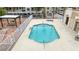 Community pool and spa with shaded seating, surrounded by a security fence at 2040 Mesquite Ln # 203, Laughlin, NV 89029