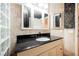 Stylish bathroom features granite counters, updated lighting, tile walls, and decorative wallpaper at 2050 W Warm Springs Rd # 4322, Henderson, NV 89014
