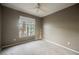 Neutral bedroom features a large window providing natural light and views of the outdoors at 2050 W Warm Springs Rd # 4322, Henderson, NV 89014