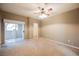 Spacious bedroom with a ceiling fan and sliding glass doors to a balcony at 2050 W Warm Springs Rd # 4322, Henderson, NV 89014