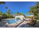 Resort style pool and lounge area surrounded by palm trees creating a luxurious outdoor space at 2050 W Warm Springs Rd # 4322, Henderson, NV 89014