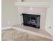 Close-up of fireplace with tile surround and glass screen at 2050 W Warm Springs Rd # 4322, Henderson, NV 89014