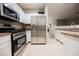 Bright kitchen with stainless steel refrigerator and oven, and neutral countertops at 2050 W Warm Springs Rd # 4322, Henderson, NV 89014