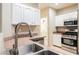 Stainless steel appliances and double sinks complement the kitchen space at 2050 W Warm Springs Rd # 4322, Henderson, NV 89014