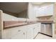Kitchen featuring white cabinets, stainless steel appliances, and granite counters at 2050 W Warm Springs Rd # 4322, Henderson, NV 89014