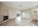 Spacious living room featuring a cozy fireplace and sliding glass doors at 2050 W Warm Springs Rd # 4322, Henderson, NV 89014