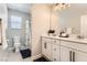 Well lit bathroom with double sink vanity, shower, and neutral color scheme at 2417 Fasano St, Henderson, NV 89044