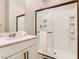Clean bathroom with a white vanity, quartz countertop, and glass enclosed shower at 2417 Fasano St, Henderson, NV 89044