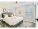 Cozy bedroom with large window, carpet, and decorative lighting at 2417 Fasano St, Henderson, NV 89044