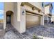 Home with a two car garage, stone accents, and paved driveway at 2417 Fasano St, Henderson, NV 89044