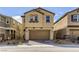 Charming two-story home with a brown two car garage and low maintenance landscape at 2417 Fasano St, Henderson, NV 89044