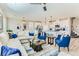A spacious living room featuring modern decor, plush seating, and an open floor plan with adjacent kitchen at 2417 Fasano St, Henderson, NV 89044