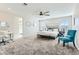 Large main bedroom with plush carpeting, ceiling fan, and natural light from multiple windows at 2417 Fasano St, Henderson, NV 89044