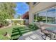 Serene backyard featuring artificial turf and mature landscaping, offering a private retreat at 2440 Ping Dr, Henderson, NV 89074
