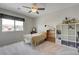 Bedroom with a bed, large window, and a white cube shelving unit at 2440 Ping Dr, Henderson, NV 89074