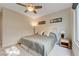 Comfortable bedroom featuring a plush bed, soft lighting, and a serene ambiance perfect for relaxation, with lovely natural light at 2440 Ping Dr, Henderson, NV 89074