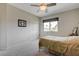 Simple bedroom featuring a bed, closet with sliding doors, and natural light from a window at 2440 Ping Dr, Henderson, NV 89074